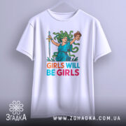 Футболка дівчата такі дівчата, біла, зображена на вішалці, фон світло-сірий, принт з дівчиною з зеленим волоссям, що тримає меч і голову, текст 'GIRLS WILL BE GIRLS' яскравих кольорів.